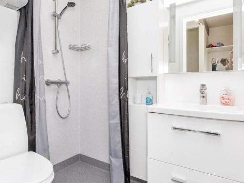 a bathroom with a shower and a toilet and a sink at 6 person holiday home in Hadsund-By Traum in Hadsund