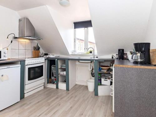 a kitchen with a sink and a counter top at 3 person holiday home in Ærøskøbing-By Traum in Ærøskøbing