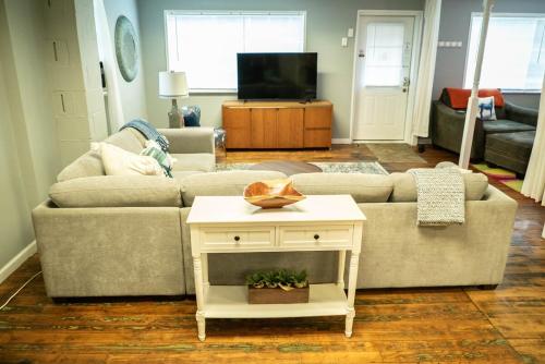 a living room with a couch and a table at Perfect in Pilot Mtn-Unit 1 Walk to Downtown! in Pilot Mountain