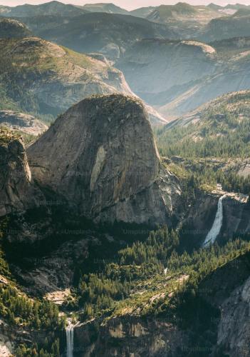 a view of a mountain with two waterfalls at The Blue Resort of Yosemite - Pool, Spa, Games in Mariposa