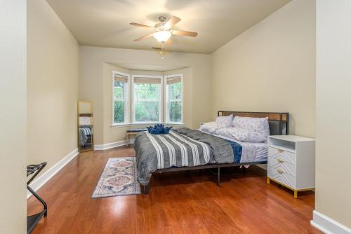 a bedroom with a bed and a ceiling fan at The Blue Resort of Yosemite - Pool, Spa, Games in Mariposa