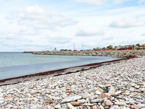 a rocky beach with water and a rocky shore at 3 person holiday home in LÖTTORP-By Traum in Löttorp