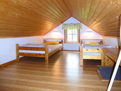 Katil atau katil-katil dalam bilik di 6 person holiday home in VITTARYD-By Traum