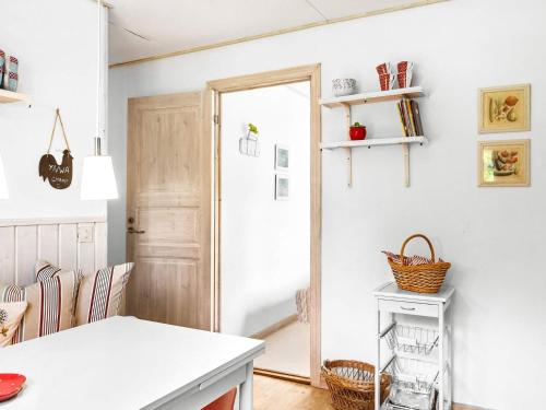 a kitchen with a white counter and a door at 8 person holiday home in SKÅNES FAGERHULT-By Traum in Skånes Fagerhult