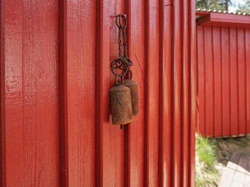 a red wall with a padlock on it at 5 person holiday home in STRÄNGNÄS-By Traum in Strängnäs