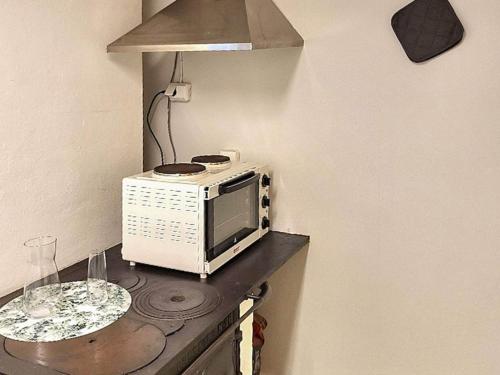 a microwave sitting on a counter in a kitchen at 5 person holiday home in HALTORP-By Traum in Halltorp