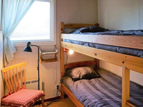 a bedroom with two bunk beds and a window at 5 person holiday home in Mörbylånga-By Traum in Mörbylånga