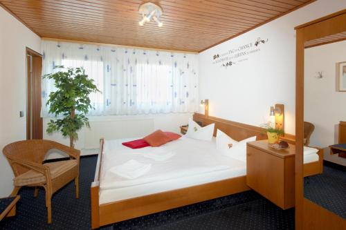 Postel nebo postele na pokoji v ubytování City Hotel Hanau