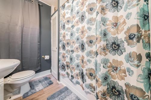 a bathroom with a toilet and a shower at Just Like Home in Cleveland