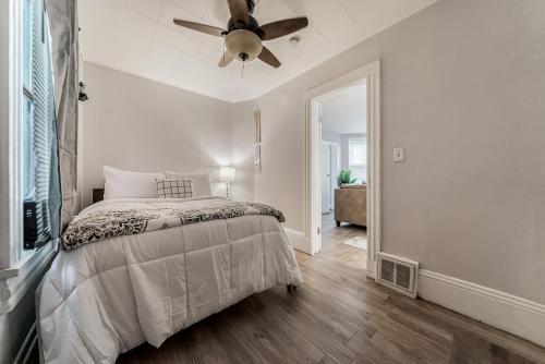a bedroom with a bed and a ceiling fan at Just Like Home in Cleveland