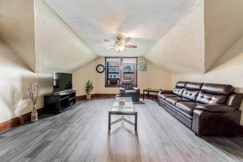 a living room with a couch and a table at Just Like Home in Cleveland