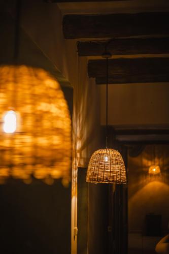 a lamp hanging from a wall in a room at THIS IS COLOMBIA HOSTEL in San Gil