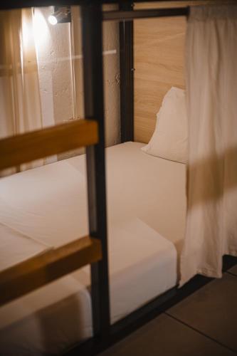 a view of a bunk bed through a window at THIS IS COLOMBIA HOSTEL in San Gil