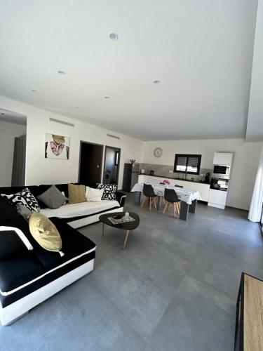 a large living room with couches and tables in it at Villa house 120m2 4 chambre 4 lit double in Les Tourrettes