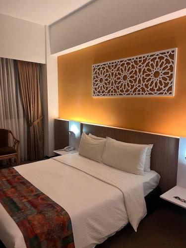 Postel nebo postele na pokoji v ubytování De Palma Hotel Ampang