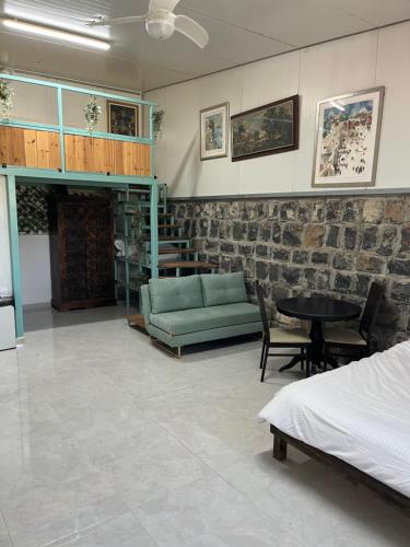 a living room with a couch and a table at בלב המשק קרוב לנחל in Bet Hillel
