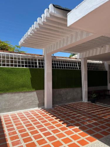 a white pergola on the side of a house at Comfort and an excellent area in Venezuela in Maracaibo