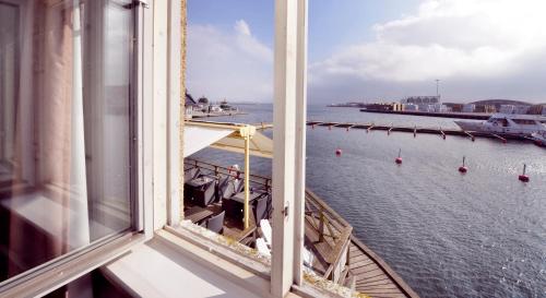 a view of the ocean from a window of a ship at Clarion Collection Hotel Packhuset in Kalmar