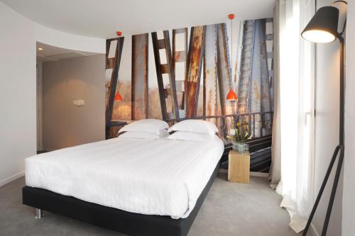 Un pat sau paturi într-o cameră la L’Échappée Belle