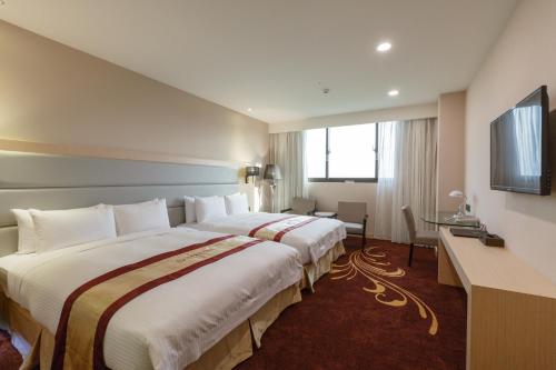 Postel nebo postele na pokoji v ubytování Royal Gold Hotel