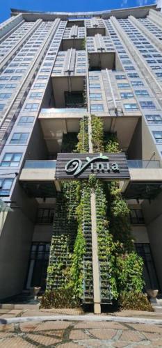 a building with plants growing on the side of it at JAM'S STAYcation at Vinia Residences in Manila