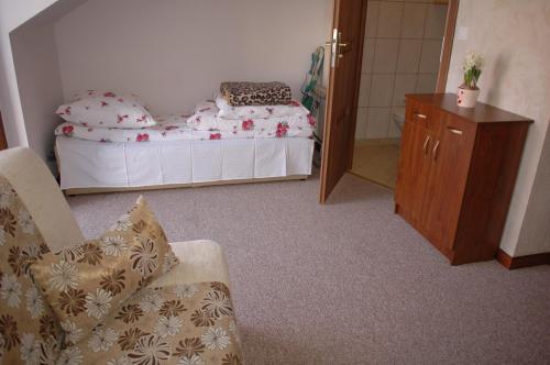 Una cama o camas en una habitación de Dom Wczasowy ISABELLE