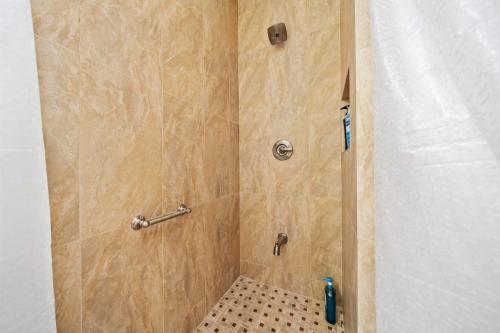 a bathroom with a shower with a tiled floor at Entire Private 4-BR w Pool, Hot Tub, King Bed, Garage, Available Now in El Cajon