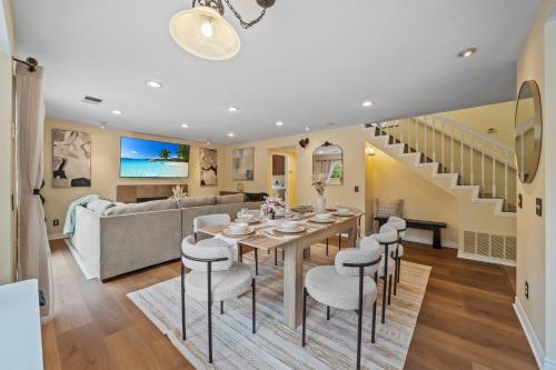 a dining room and living room with a table and chairs at Entire Private 4-BR w Pool, Hot Tub, King Bed, Garage, Available Now in El Cajon