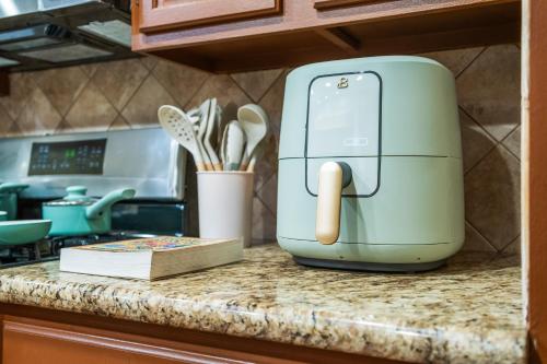 a toaster sitting on top of a kitchen counter at Entire Private 4-BR w Pool, Hot Tub, King Bed, Garage, Available Now in El Cajon