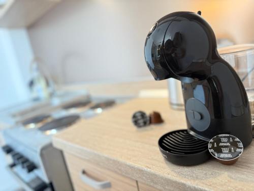 a coffee maker sitting on top of a kitchen counter at ENE Studio in Oradea