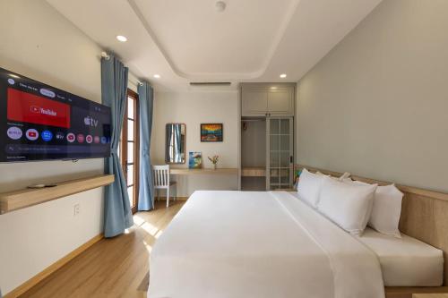Giường trong phòng chung tại La Maison De Dino Hotels & Apartments Phú Quốc