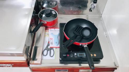a plastic box with a utensil and other items at Sweet House東池袋 in Tokyo