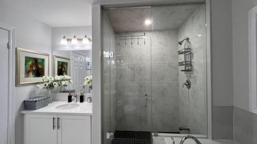 a bathroom with a shower and a sink at Elegant Oakville Town Residece in Oakville