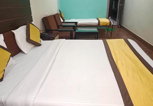 a large bed in a room with two beds at Inn imperial in Ajmer