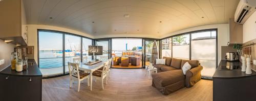 a living room with a couch and a table at Goitzsche Resort in Bitterfeld