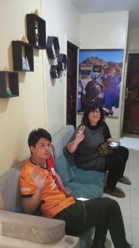 a man and a woman sitting on a couch at Sun City in Aswan