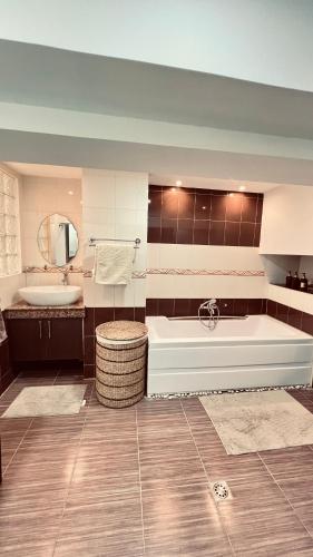 a large bathroom with a tub and a sink at Super Cebu Loft in Cebu City