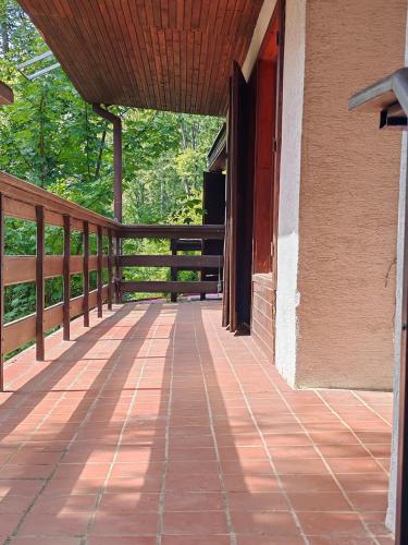an outside porch of a house with a wooden railing at Chata Limbach in Limbach