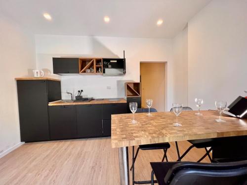 a kitchen with a table with wine glasses on it at Villa Anna Francavilla al Mare in Francavilla al Mare