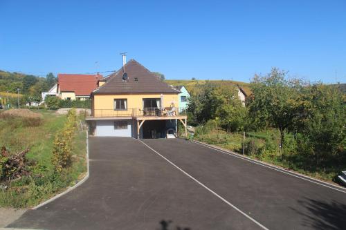 a house on the side of a road at le chemin du meunier in Riquewihr