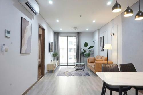 a living room with a couch and a table at Rio House district 10 Saigon Centrosa in Ho Chi Minh City