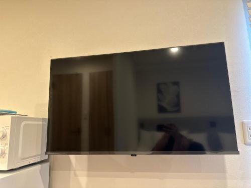 TV a/nebo společenská místnost v ubytování Akatsuki Iriya Hotel