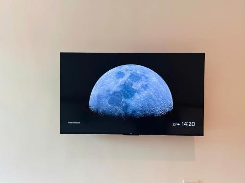 a flat screen tv hanging on a wall at Myhoa Lagoon - Kiting Town in Phan Rang