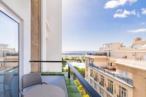 a balcony with a view of the ocean at Hotel Adonis Pelinor in Santa Cruz de Tenerife