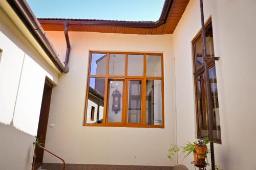 a window on the side of a house at Sibla Residence, Unique Experience Heritage House in Lugoj