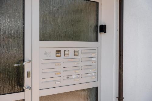 a door with a window on a building at Skyrise Apartments - Stilvoll wohnen, entspannt genießen in Bad Wörishofen
