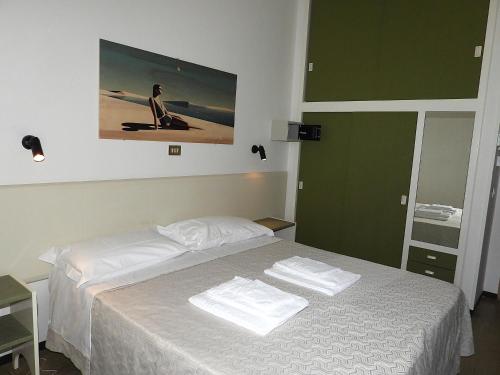 Ένα ή περισσότερα κρεβάτια σε δωμάτιο στο Hotel Internazionale