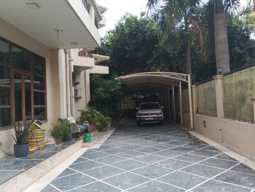 a car is parked under a parking lot at Monarch Residency Gurgaon in Gurgaon