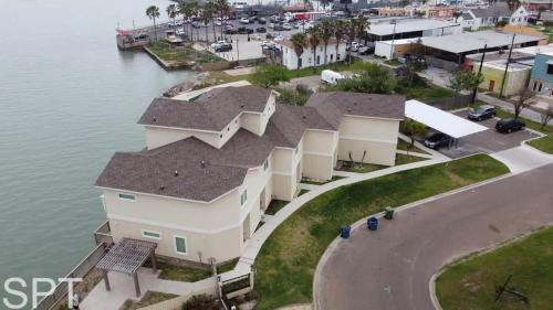 an aerial view of a house next to the water at Bungalow Tarvana-#1 in Port Isabel