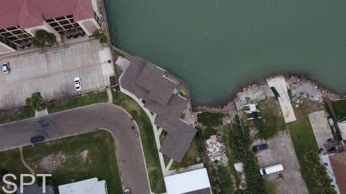 an aerial view of a house with a pond at Bungalow Tarvana-#1 in Port Isabel